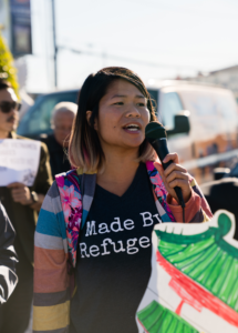 photo of Lan Nguyen holding a megaphone
